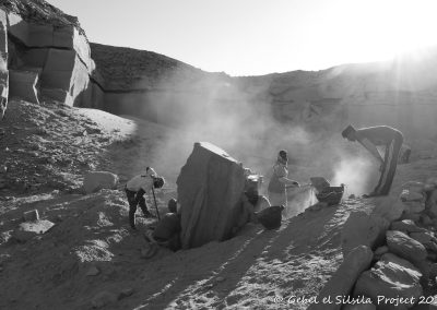 The team excavating around the fallen monument